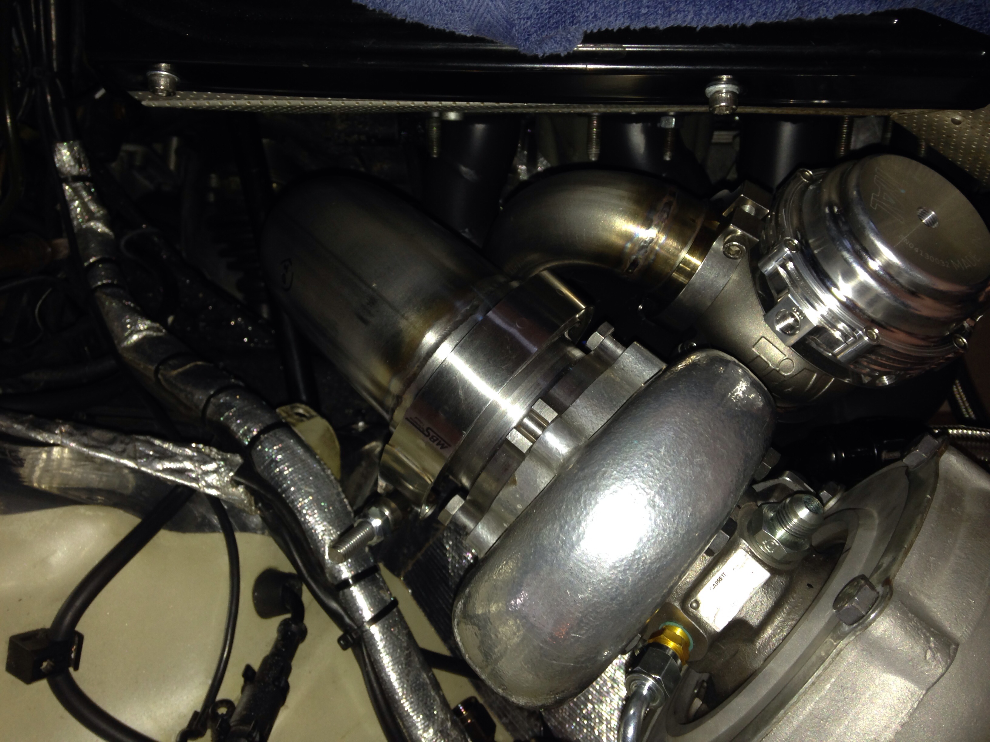 Hard to see but down pipe and waste gate piping installed