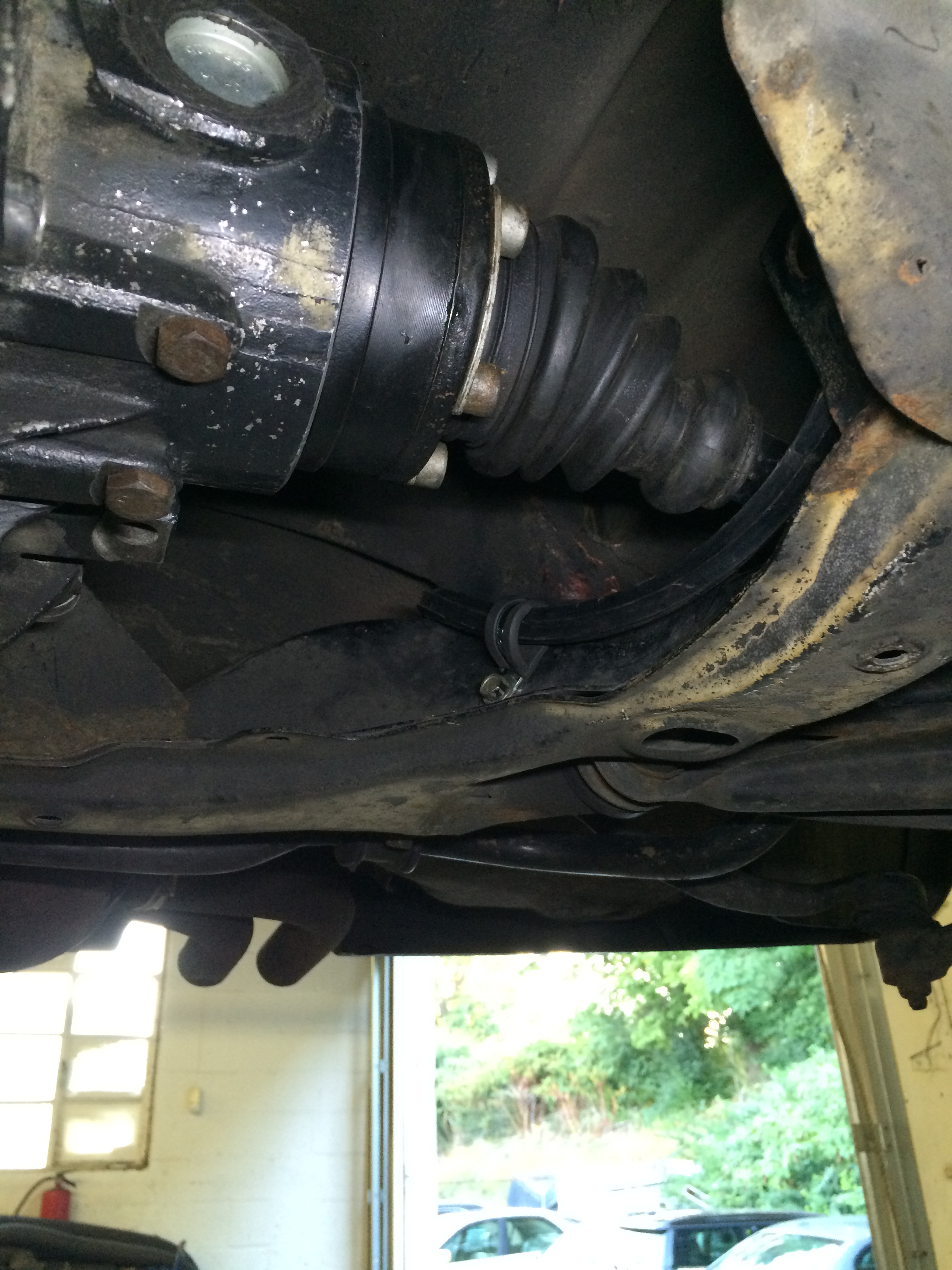 Adel clamp to hold cable to subframe on left side.