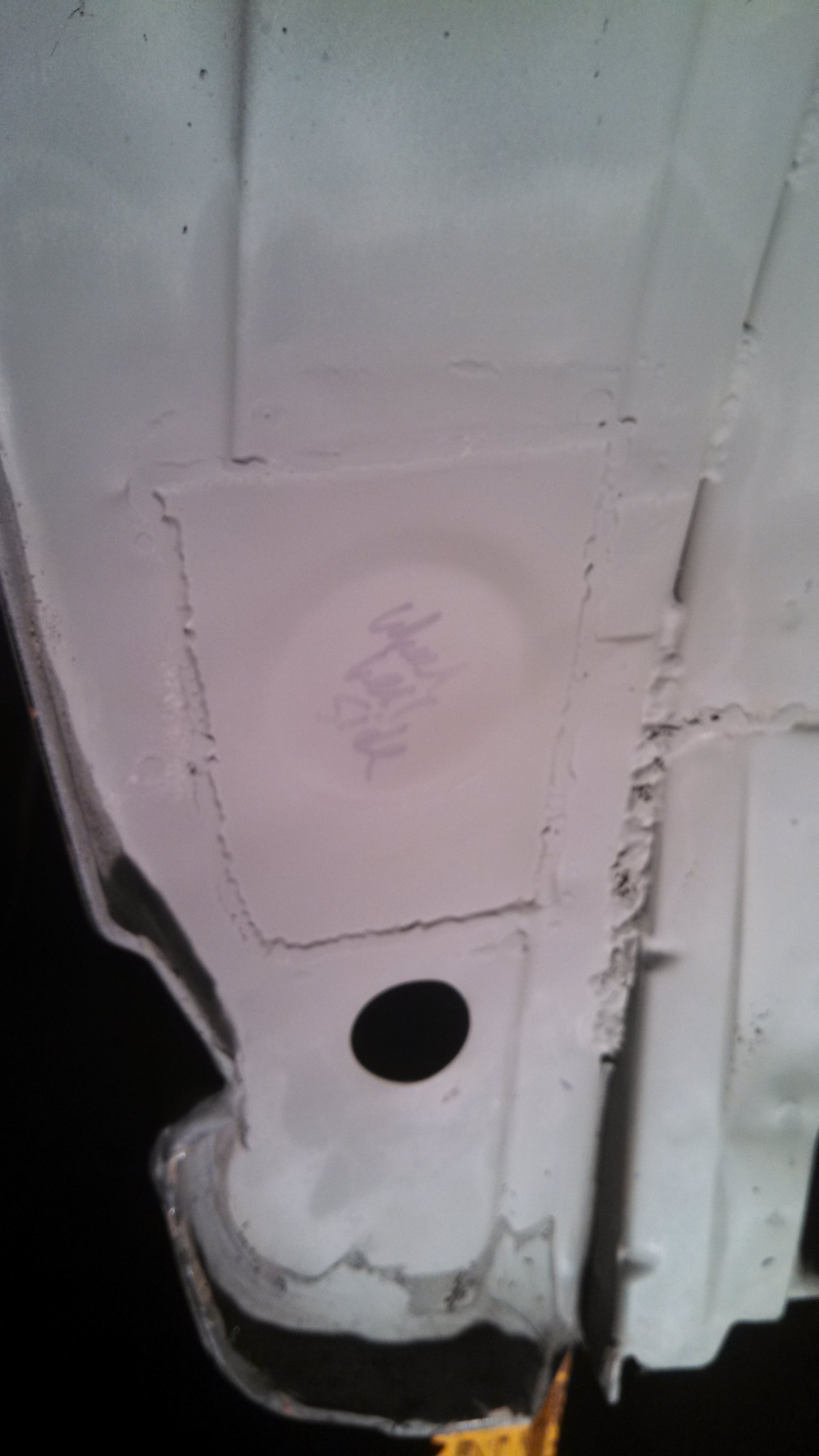 dr rear wheel well patch primed.jpg